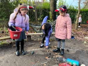 Bobbie Heap (left) and Chloe Kwok (centre) picking up litter.